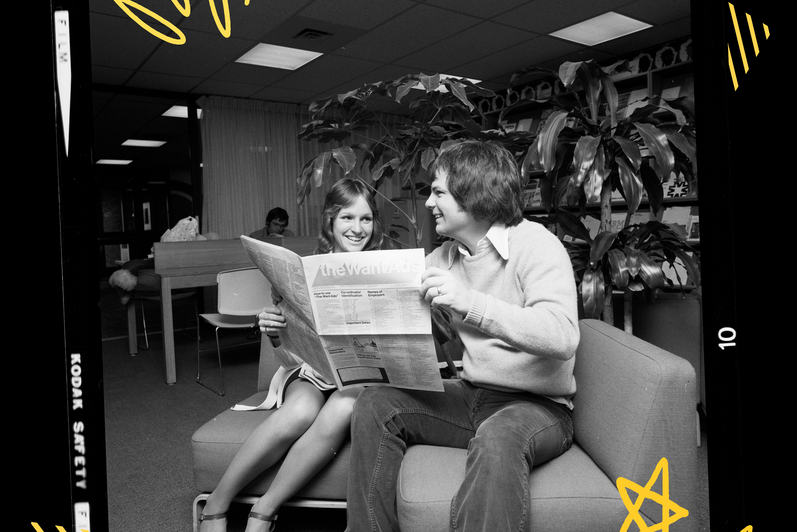 People reading newspaper