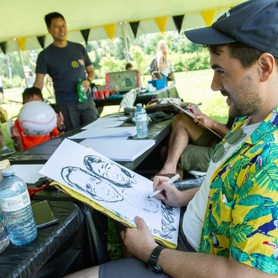 A caricature artist drawing an image