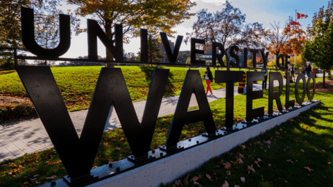 A University of Waterloo sign on campus in the fall