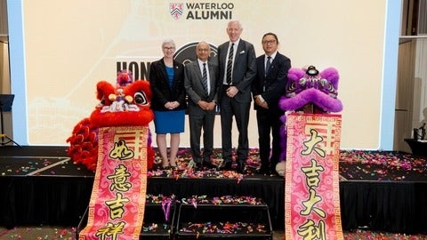 Special guests pose with lion dance costumes at the Hong Kong event
