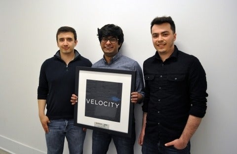 Lumotune team holding a velocity picture