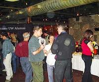 People gather at the alumni event