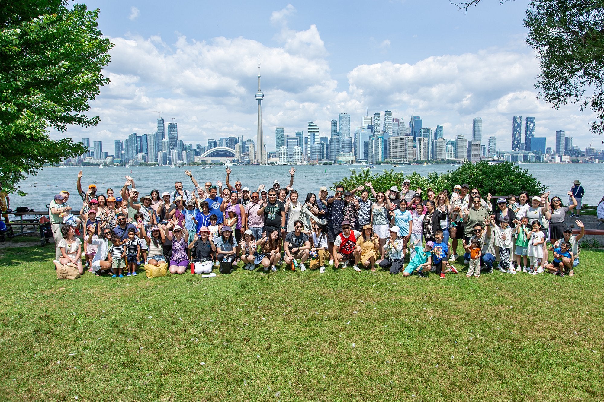 Group photo of attendees in front of the Toronto skyline