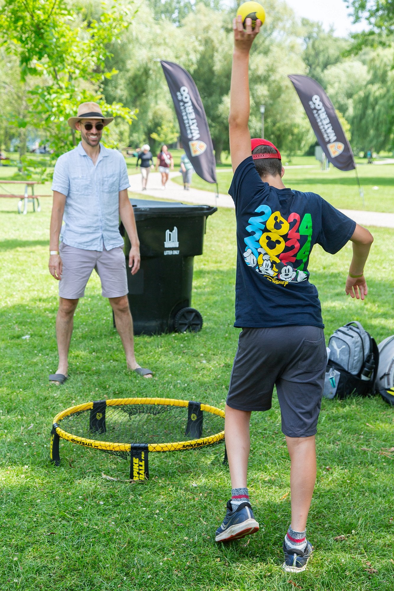 Two attendees playing spike ball