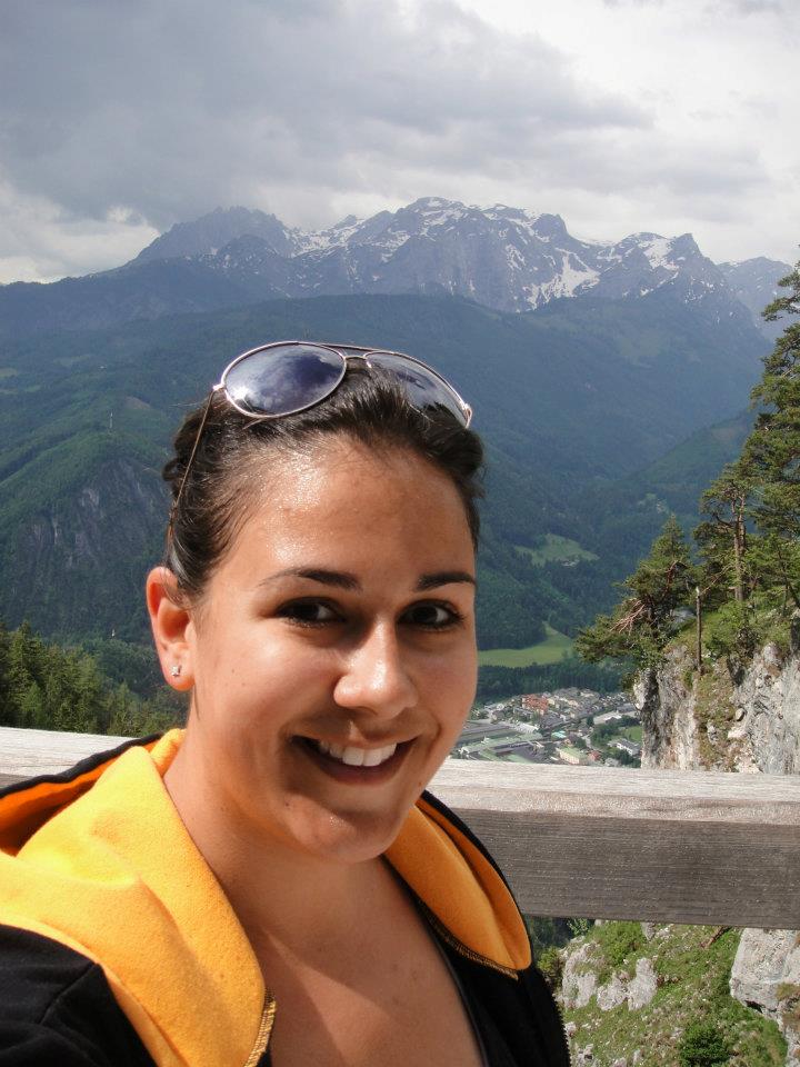 Laura wearing black and gold in Werfen, Austria, hiking through the Alps