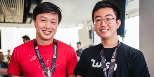 Two young Asian men wearing Waterloo lanyards