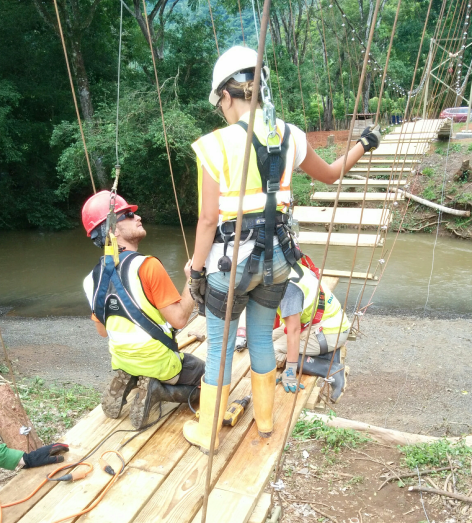 Alison and peer working to construct the bridge