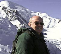 Photo of Barry Goodison with a snow covered mountain in the background