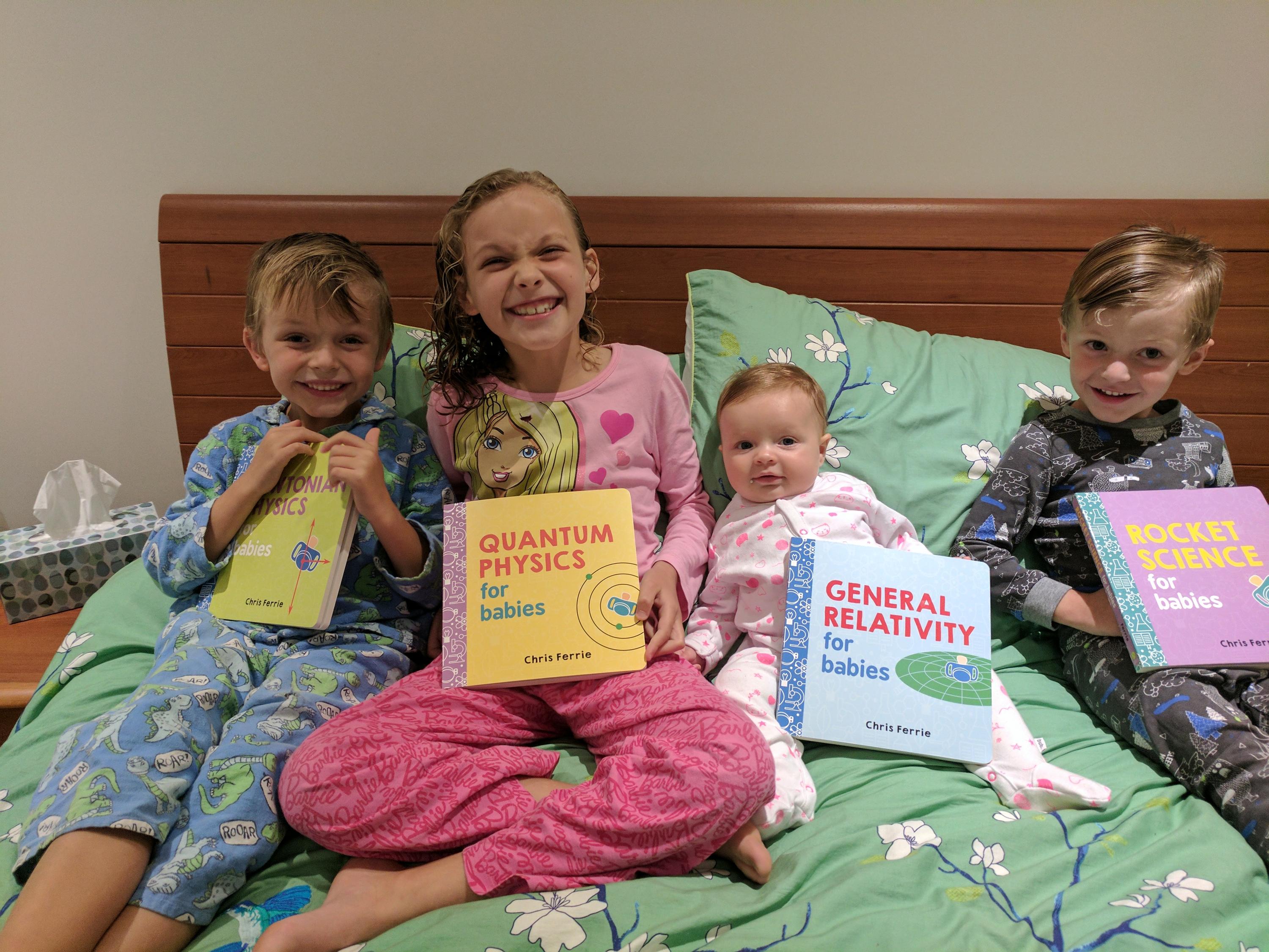 Chris's kids with the books he has written