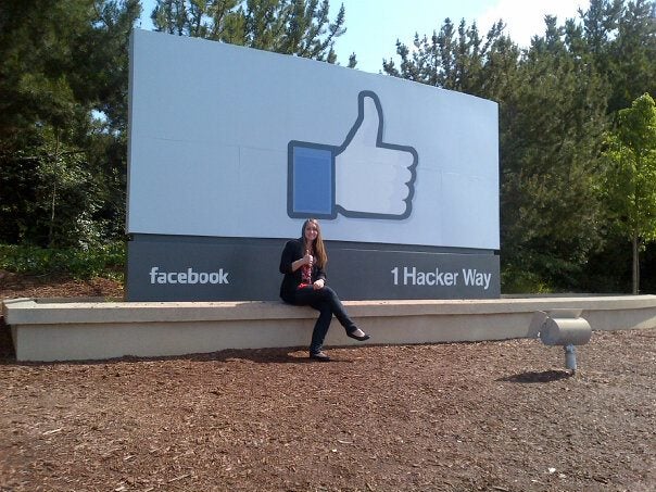 jenn in front of the facebook sign