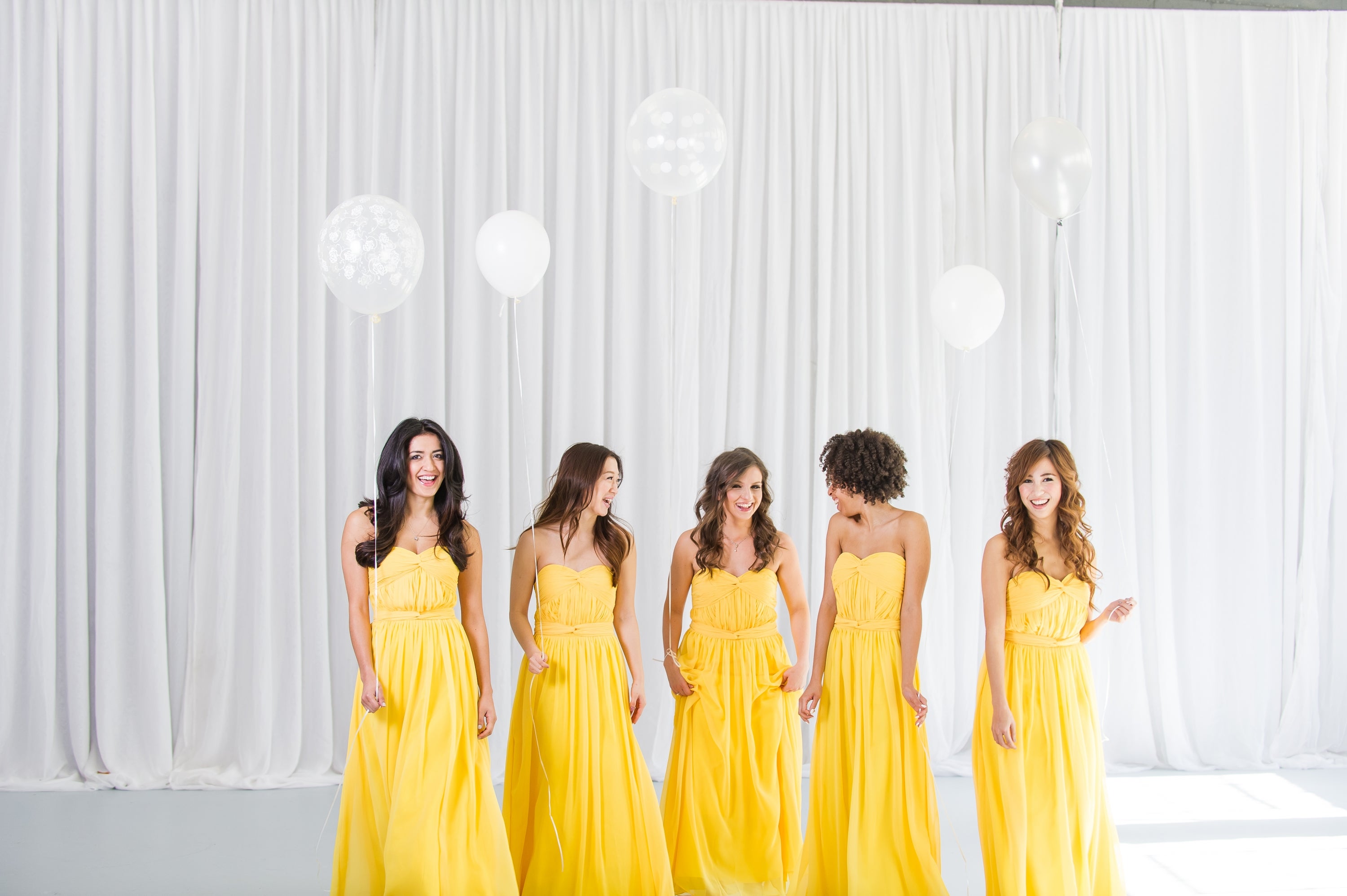 Girls in yellow bridesmaid dresses