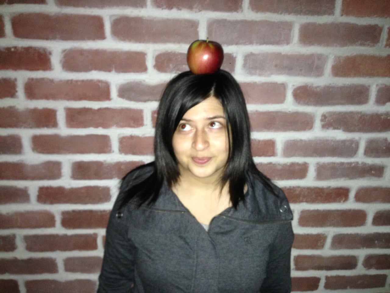 Uppi with an apple on her head