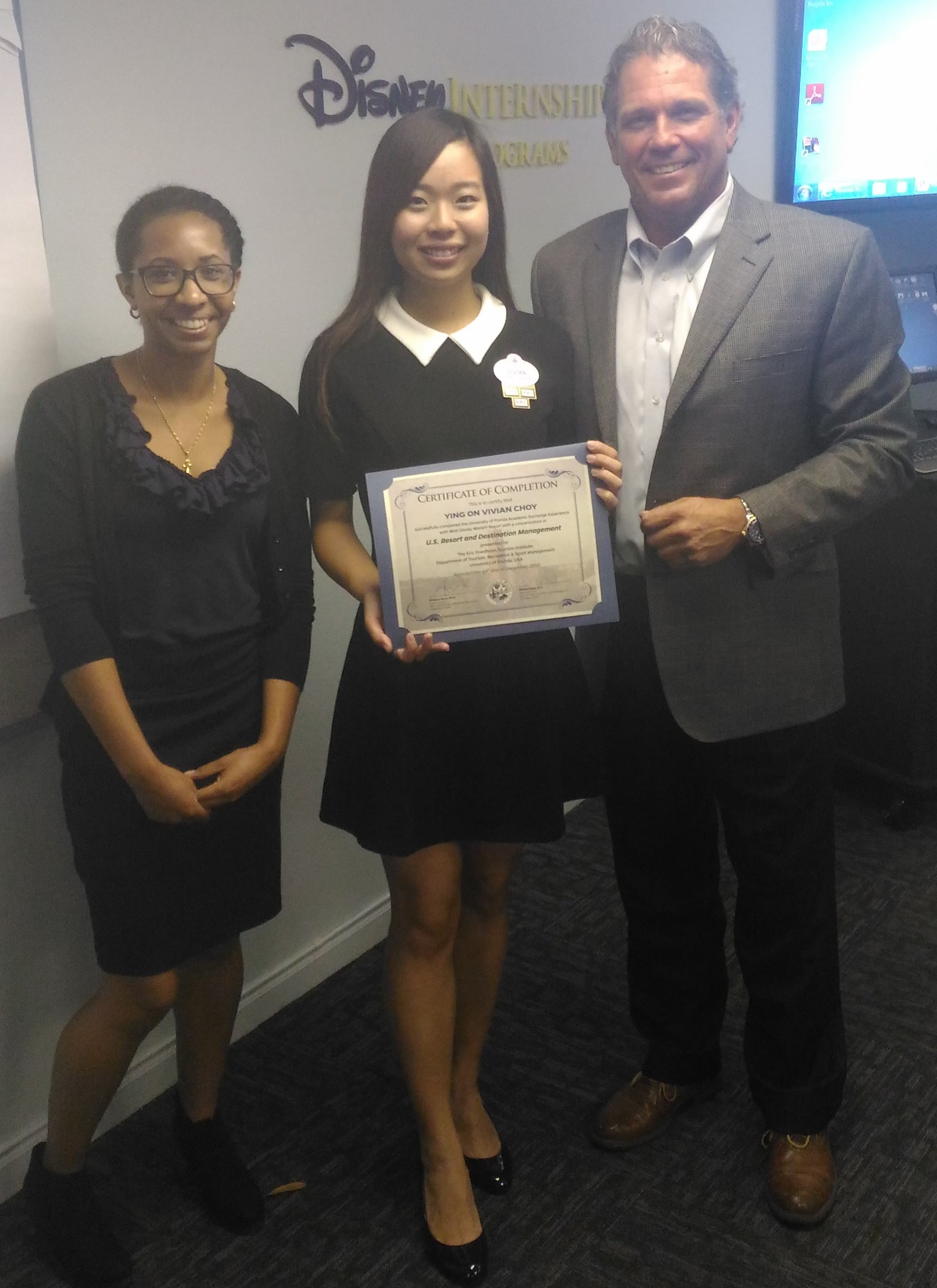 Vivian with a Disney internship certificate of completion