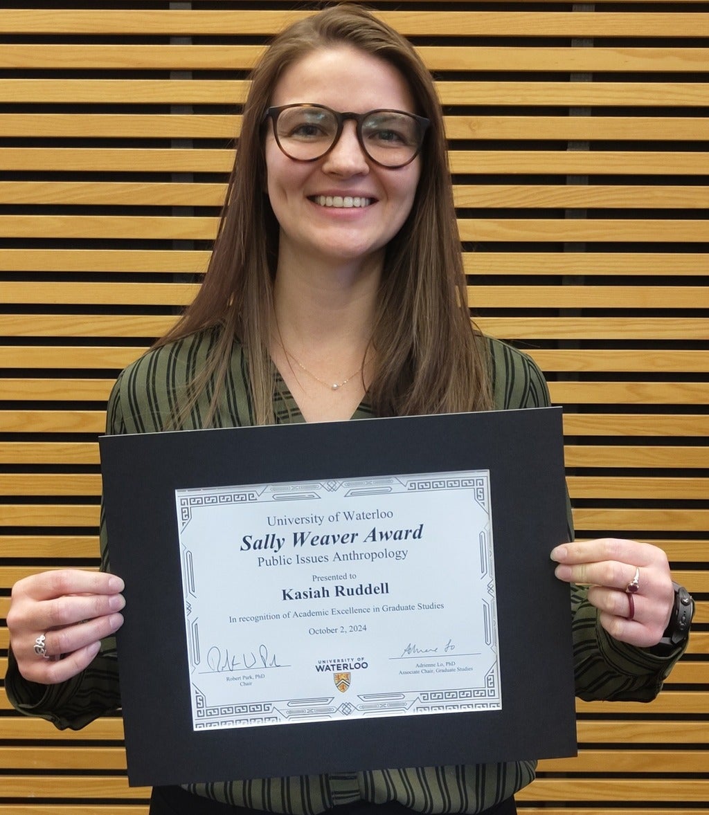 Student Displaying Certificate