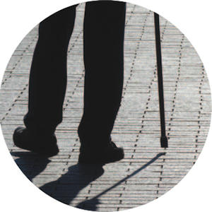 Man walking with cane.
