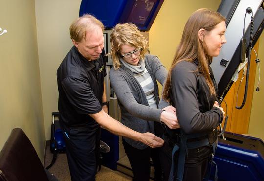 Chiropractor Jeff Goldsworthy instructs co-op student.