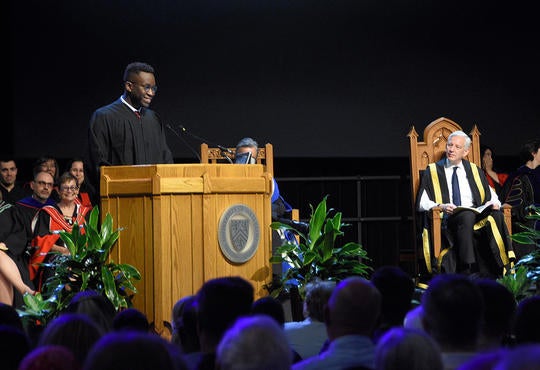 2019 valedictorian David Uponi at convocation podium.