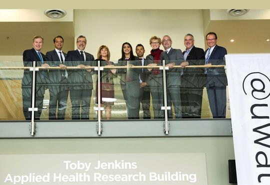 Government and faculty officials with Toby and Tom Jenkins.