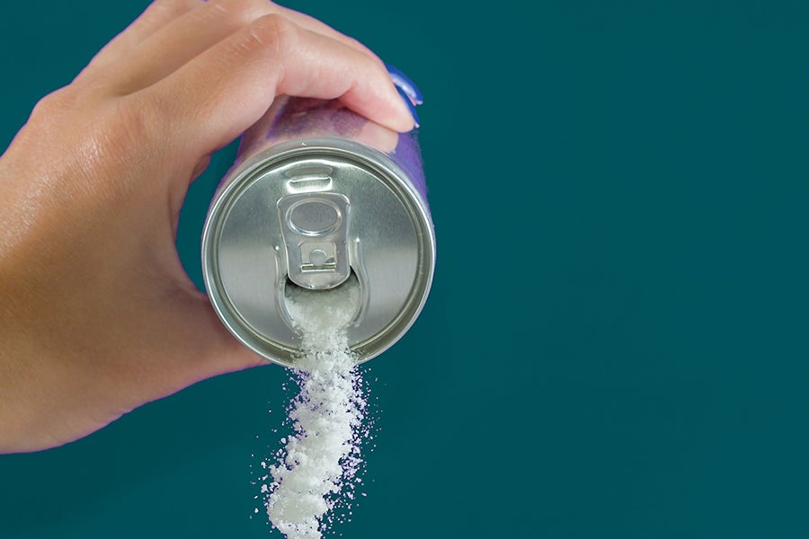 Sugar pouring out of a soda can.