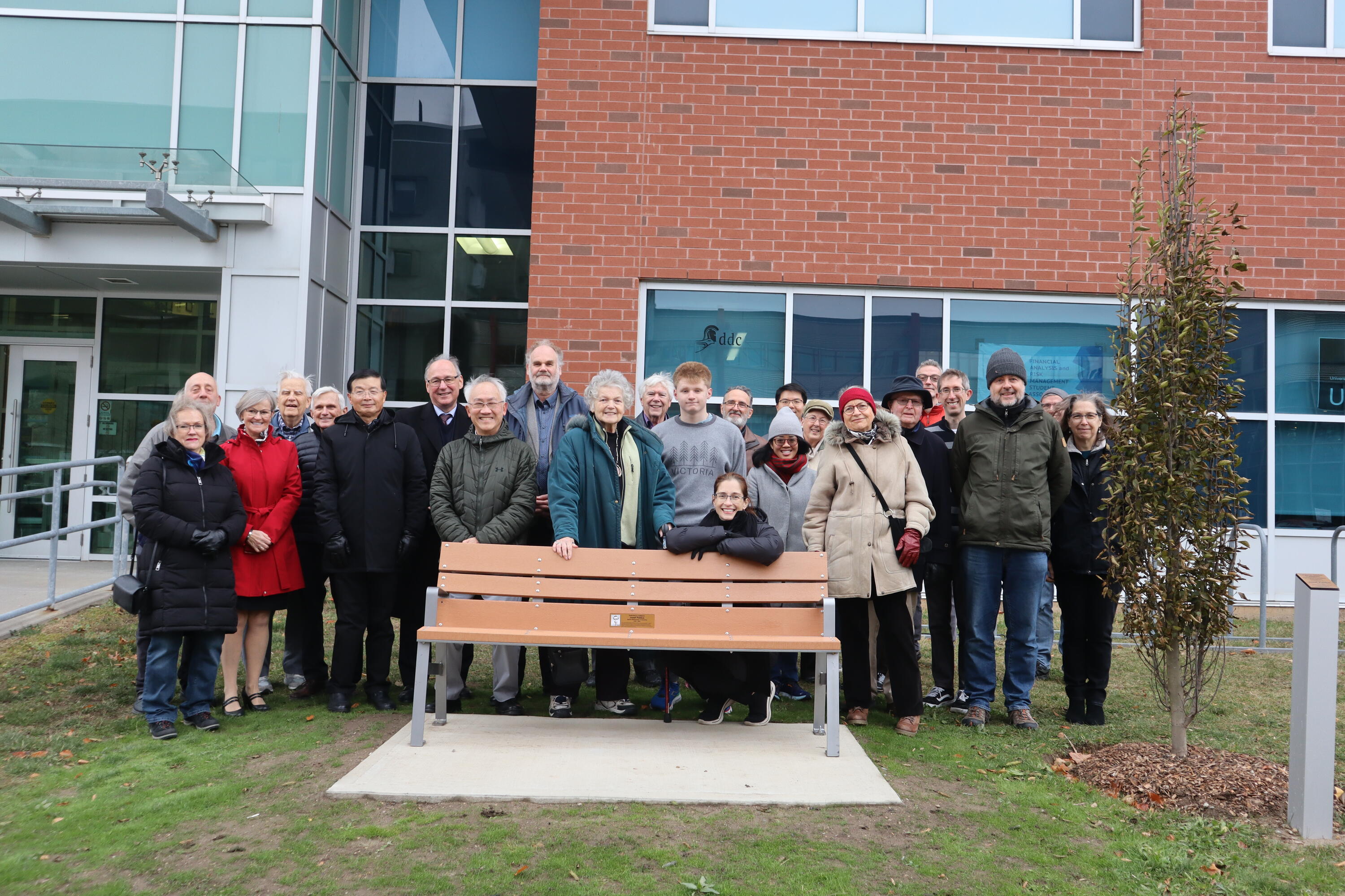 Josef Paldus's family and Applied math Staff and faculty with memorial bench 