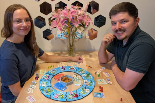 two people playing a board game.