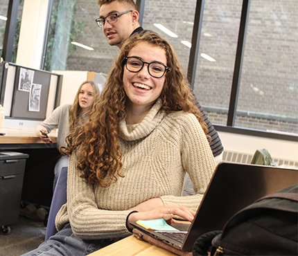 student sitting at studio desk