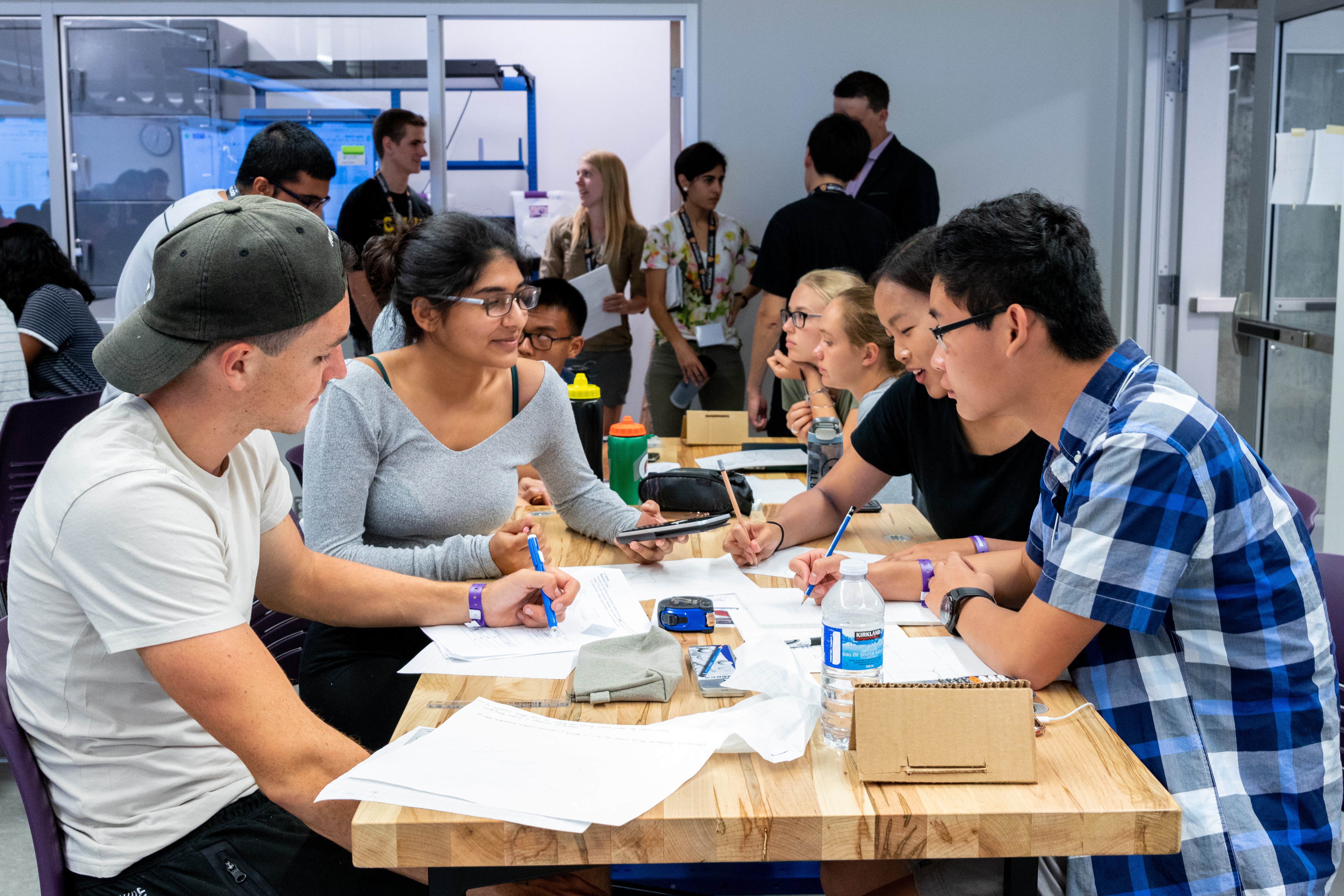 students sitting in a group at a table