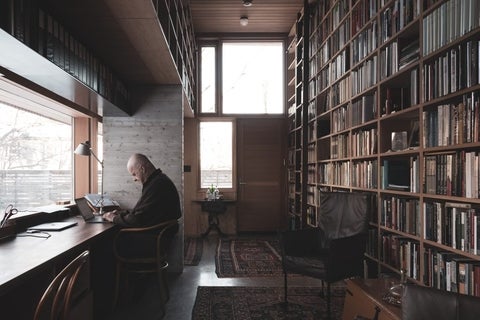 Robert Jan van Pelt works in his library.