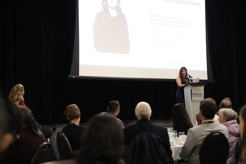 Elisia Neves speaks from the podium at the 2025 Engineering Awards Dinner