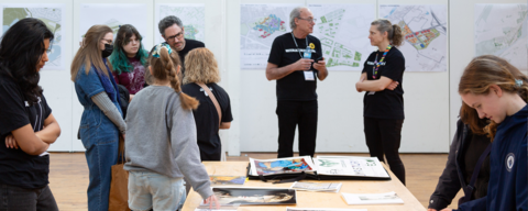 faculty speaks to visitors at a Waterloo Architecture open house