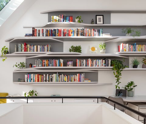 Sculptural bookshelves on the second floor of Boston a renovation by Wanda Ely
