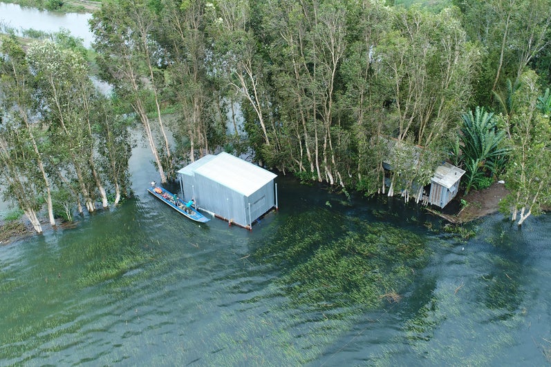 house of a rice farmer floating during the 2018 monsoon flood
