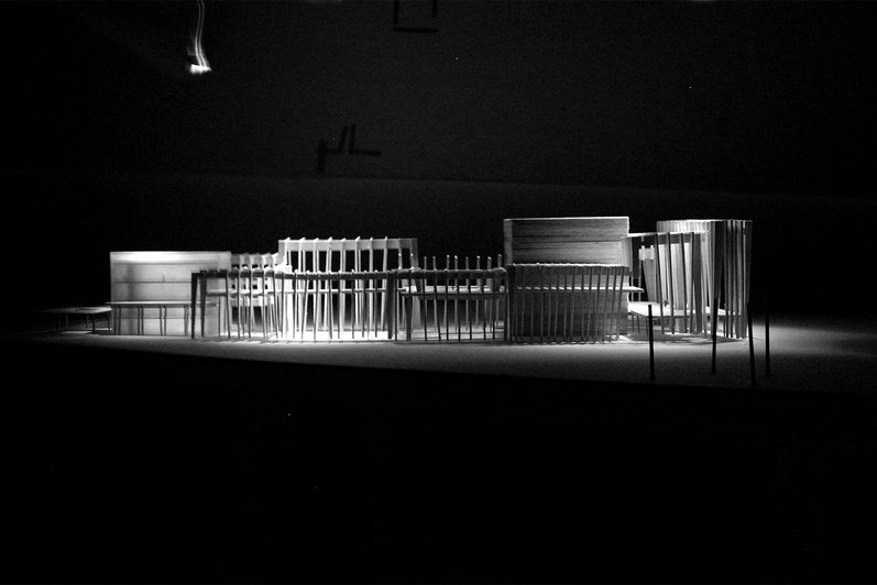 A photograph of the physical model lit from above in a dark room.