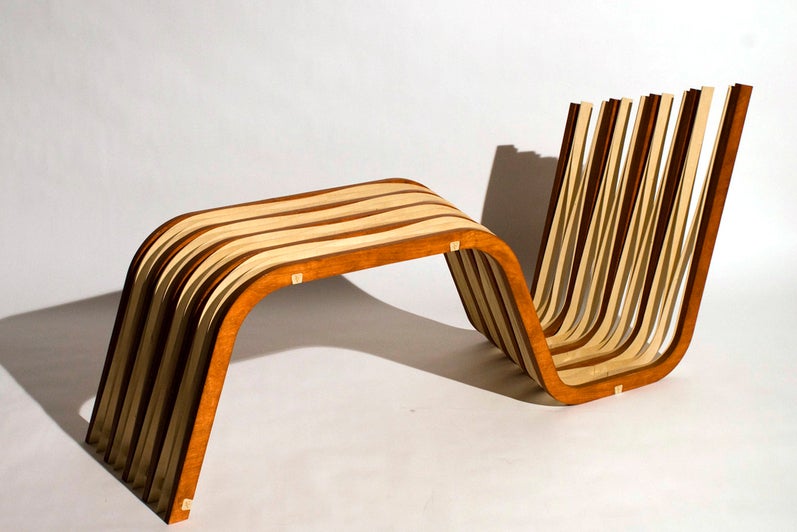 A photograph of the constructed chair, made from repetitive wood members.