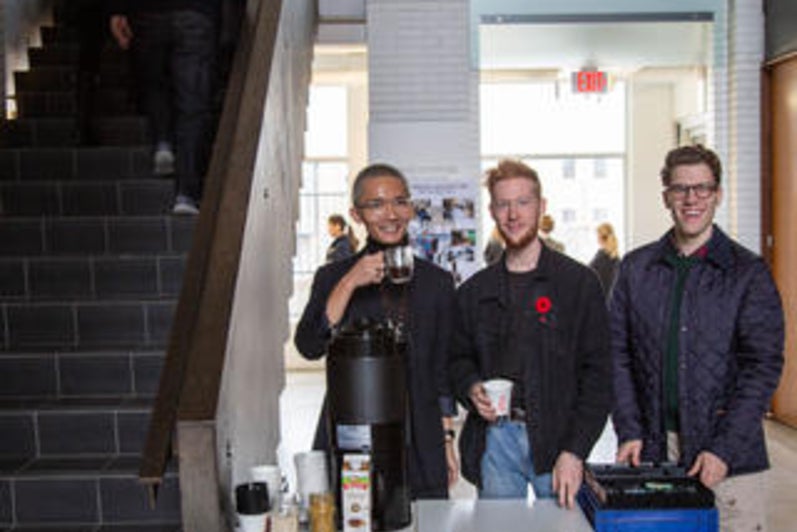 Students at Open House Offering Coffee and Q&A