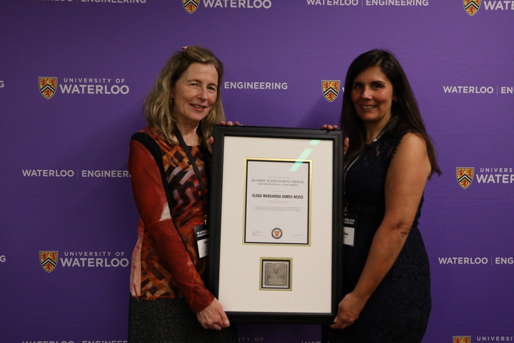 Dean Mary Wells presents Elisia Neves with the Faculty of Engineering Alumni Achievement Medal for Professional Achievement 