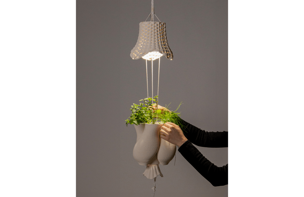 a 3d printed clay pot and light