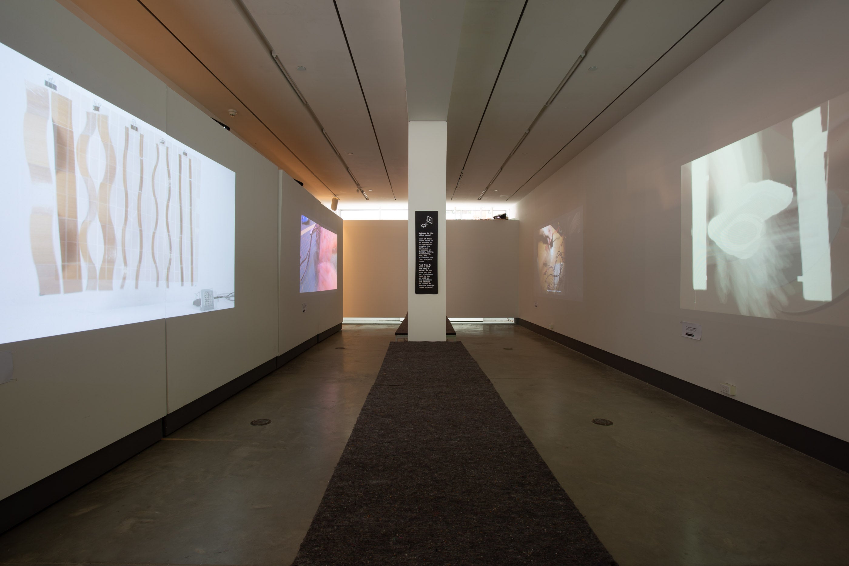 Picture of exhibition panels, drawings and projection