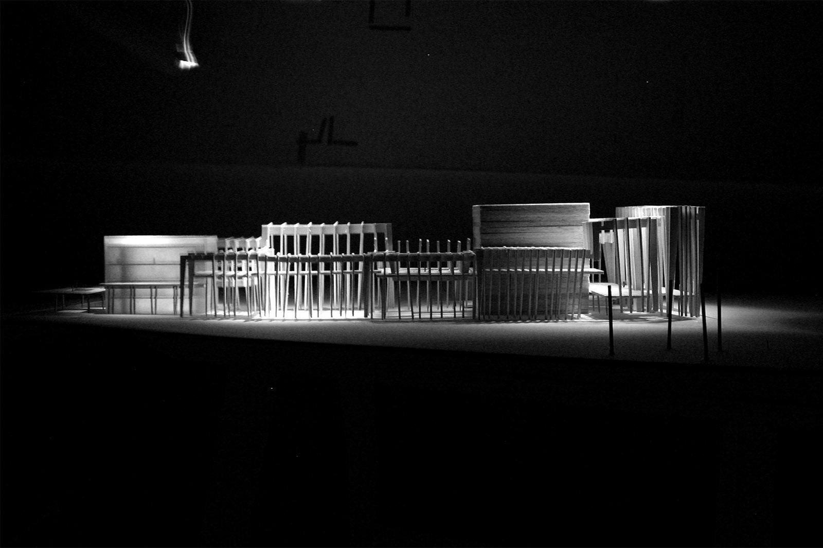 A photograph of the physical model lit from above in a dark room.