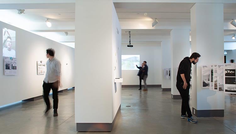 several people in white gallery space