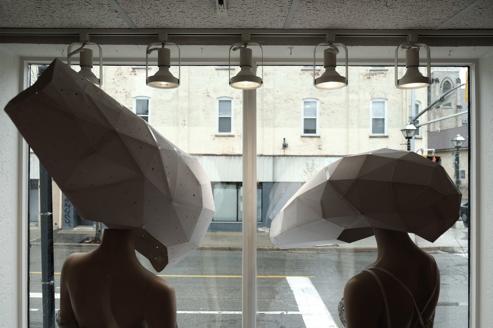 Reverse shot of two mannequins wearing masks from Jessica Hanzelkova's Artifacts of No-Place