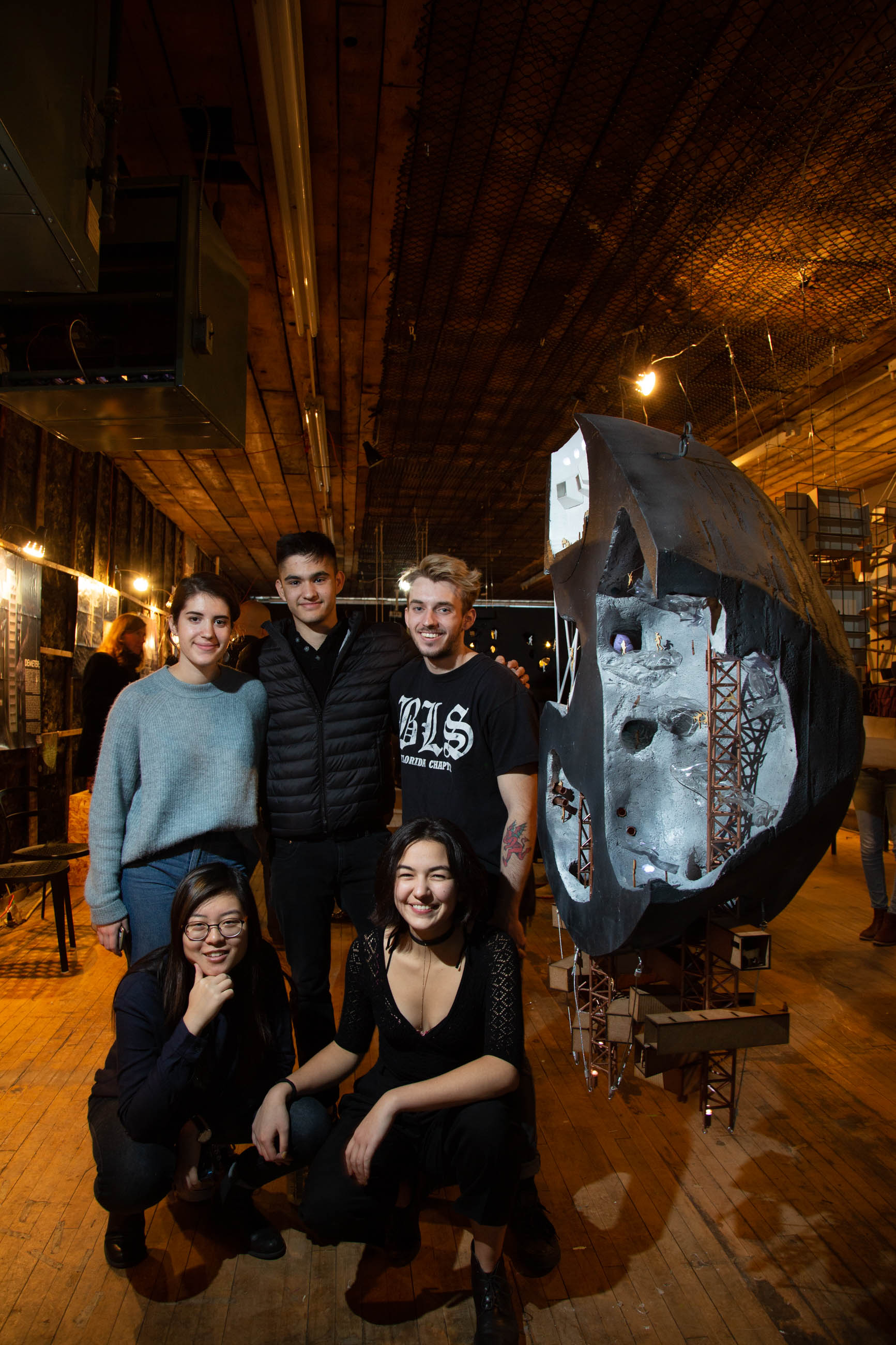 Students pose with their model