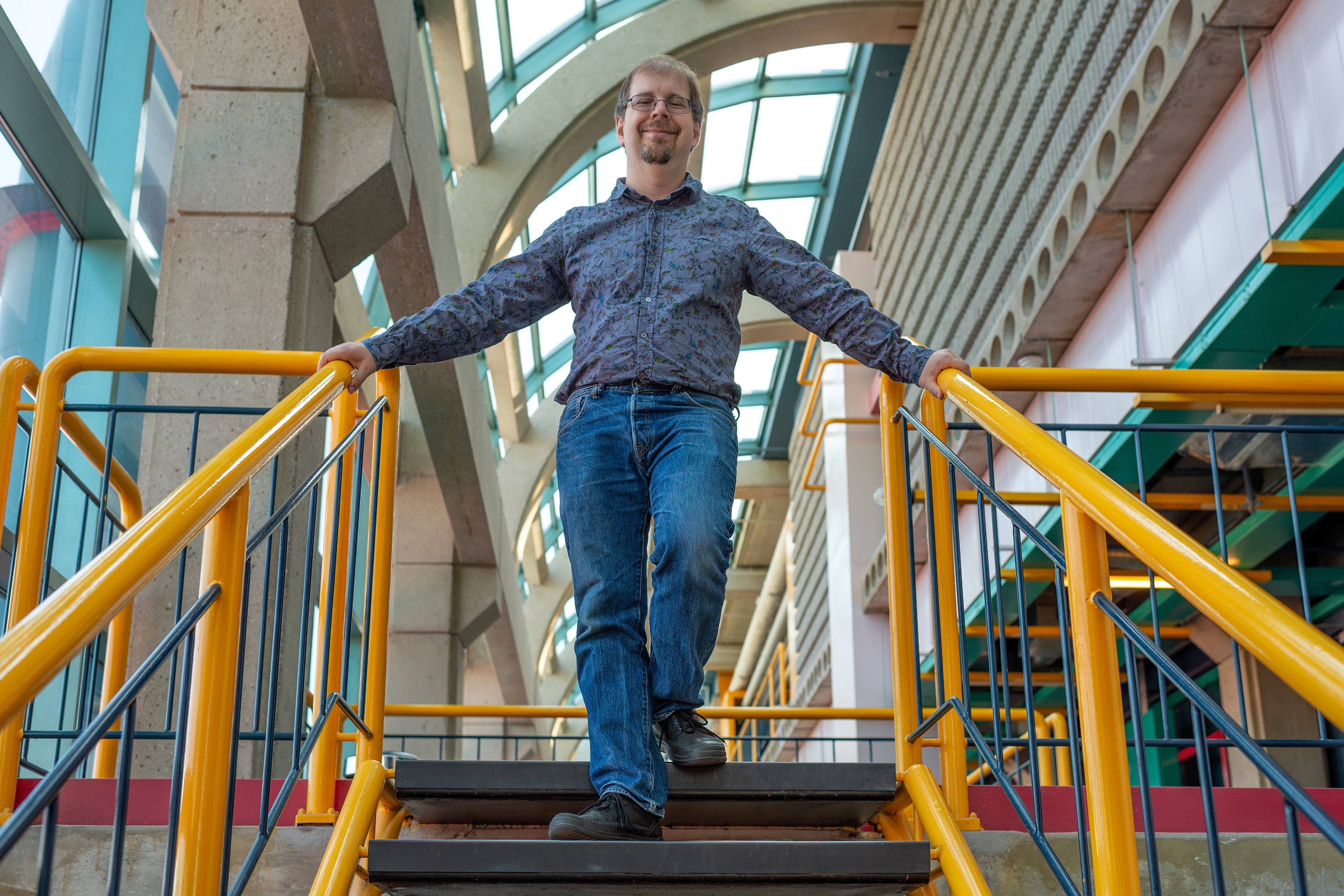 Professor Dan Brown descending stairs in Davis Centre