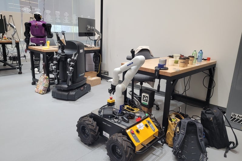 The TALOS humanoid robot and a Husky rover on display at RoboHub.