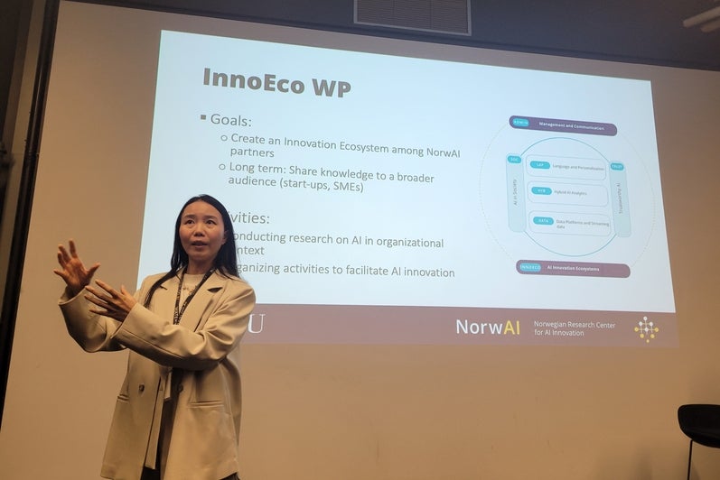A researcher presents on NTNU and NorwAI's AI innovation ecosystems.