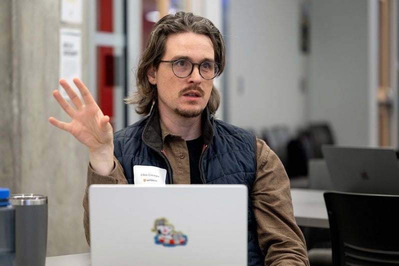 An attendee asks a question during a presentation