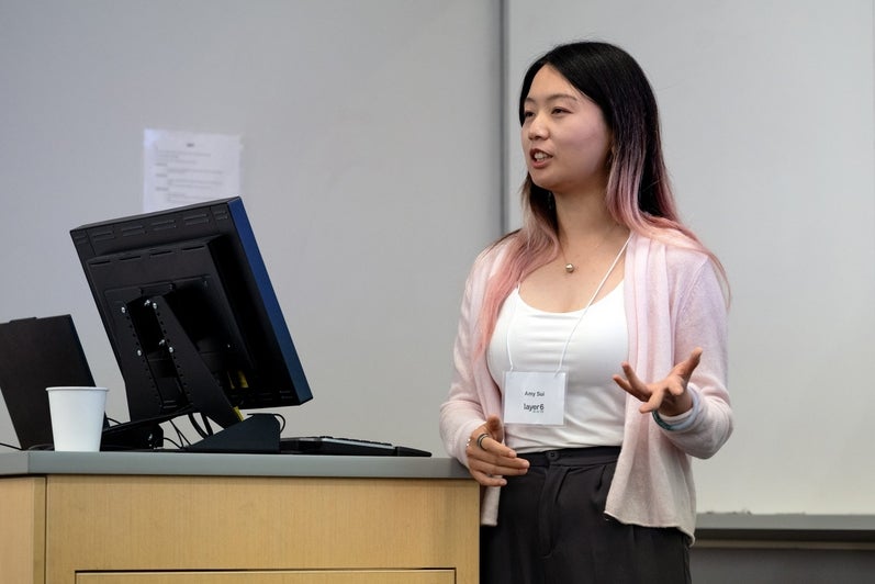 A speaker presents her research during the TD Layer 6 visit