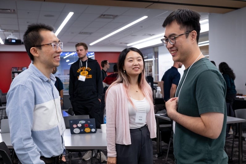 Students and researchers chat during the networking session