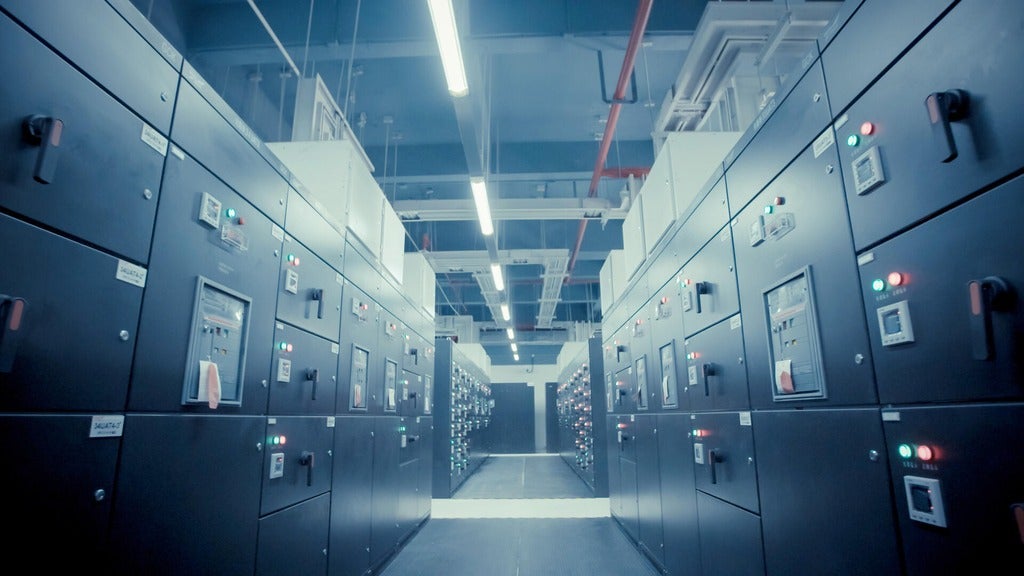 A hallway of electronic cabinets