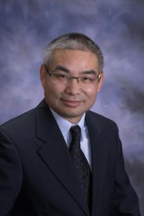 A portrait of Alan Huang